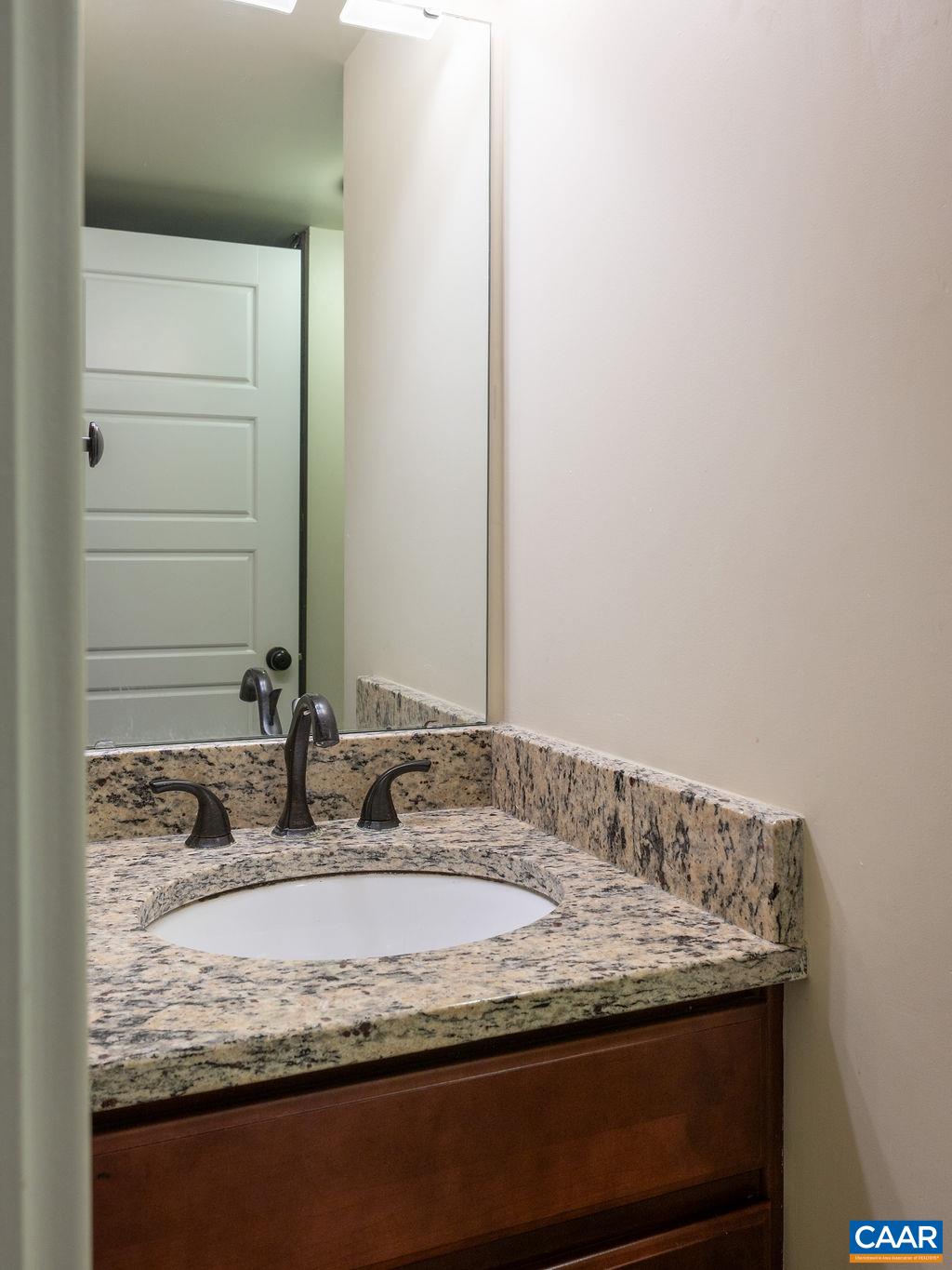 2052 Avinity Loop Charlottesville, VA 22902 - Photo 27 of 39 a bathroom with a granite countertop sink and a mirror