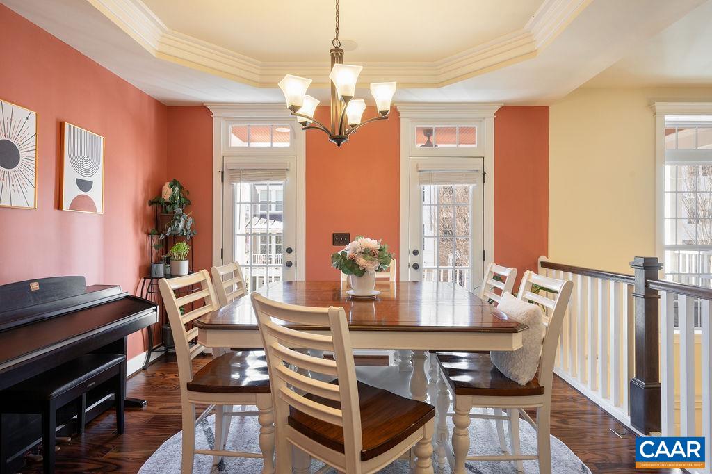 2052 Avinity Loop Charlottesville, VA 22902 - Photo 8 of 39 a view of a dining room with furniture wooden floor and chandelier