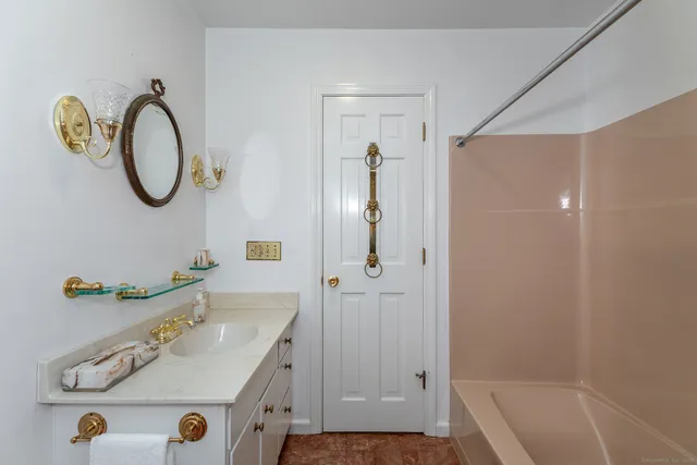 a bathroom with a sink and a mirror