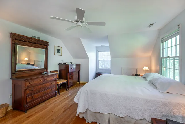 a bedroom with a bed and a dresser