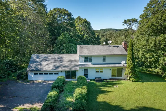 aerial view of a house with a big yard