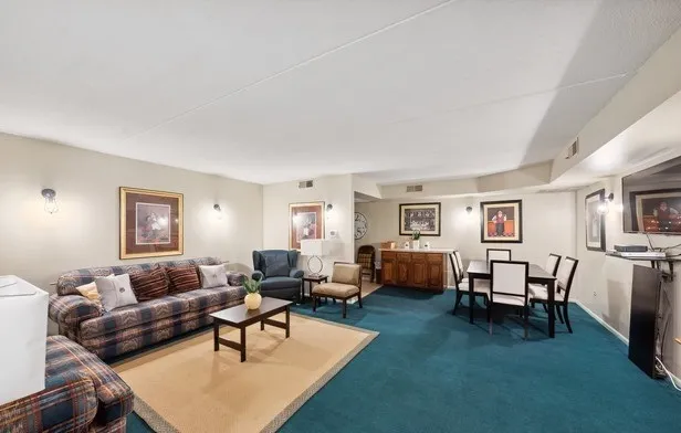 a living room with furniture and a table