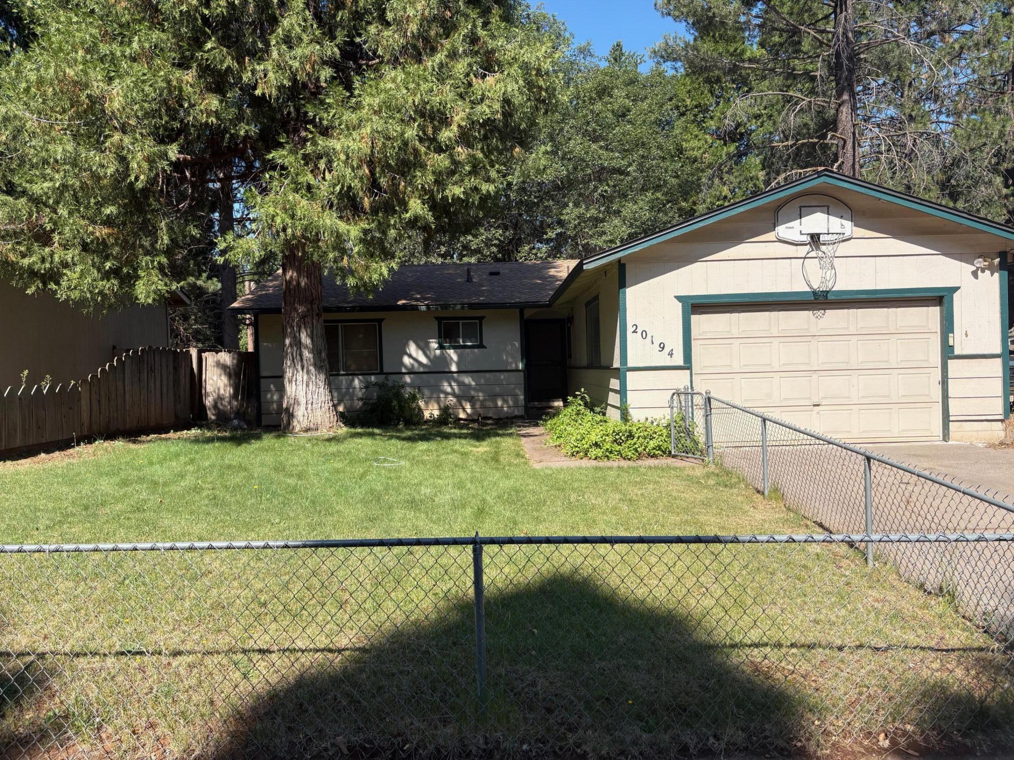 20194 Sugar Pine Street Burney, CA 96013 - Photo 2 of 15 a front view of a house with garden