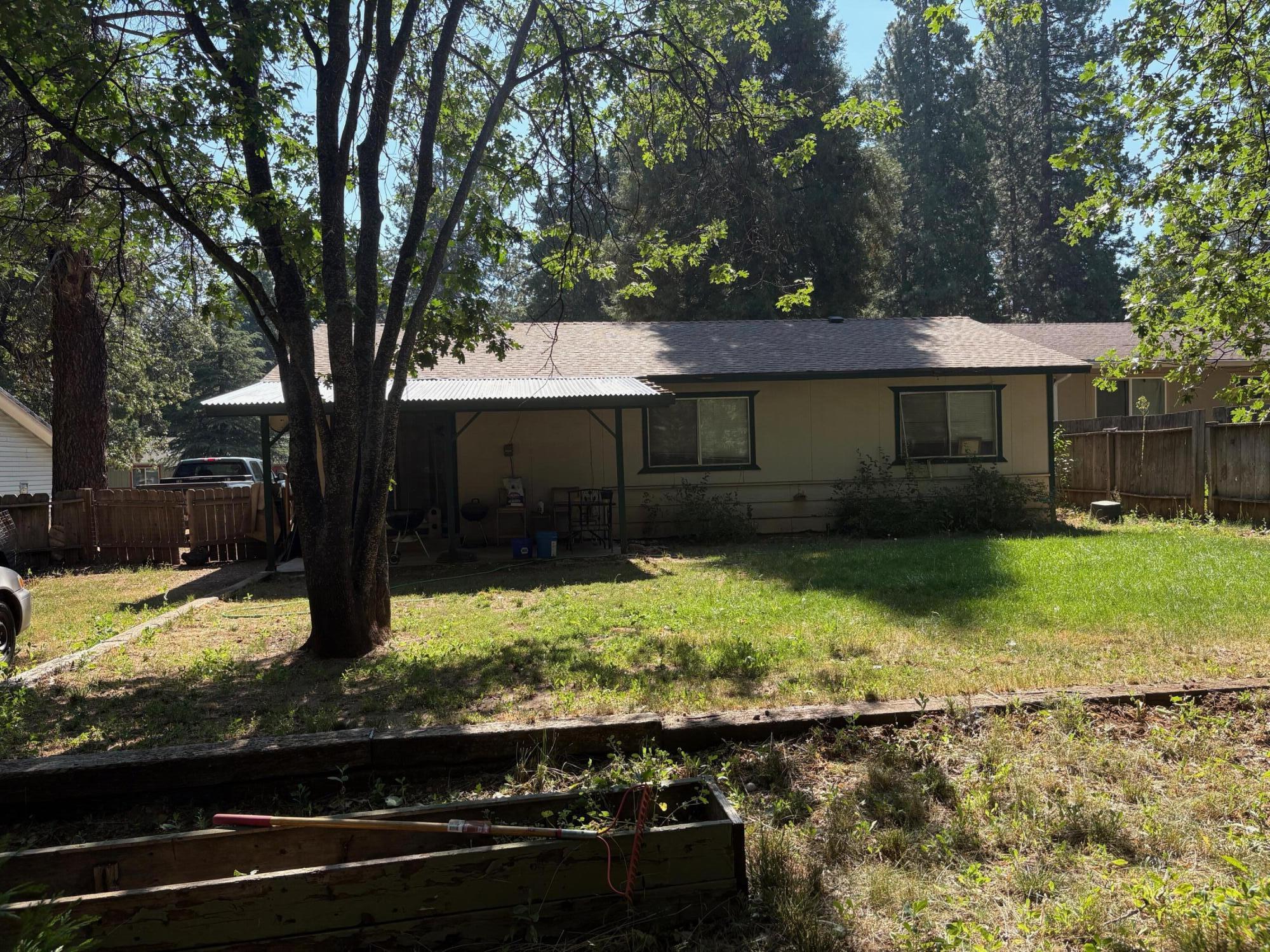 20194 Sugar Pine Street Burney, CA 96013 - Photo 3 of 15 front view of a house with a yard