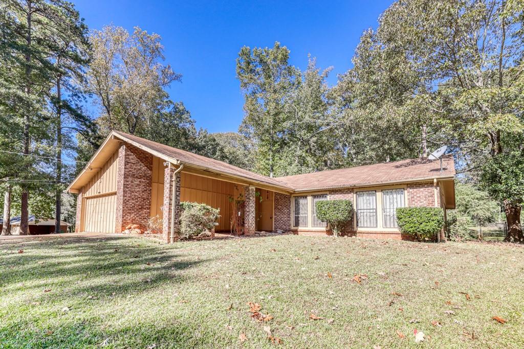 4442 Huntsman Bend Decatur, GA 30034 - Photo 1 of 1 a front view of a house with a yard and garage