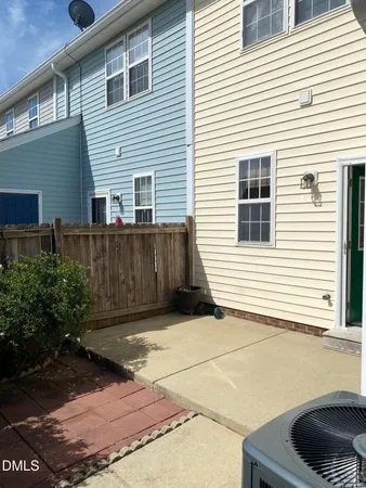 a view of backyard with seating space and plants
