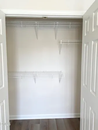 a view of an empty walk in closet