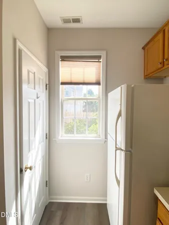 a view of empty room with windows