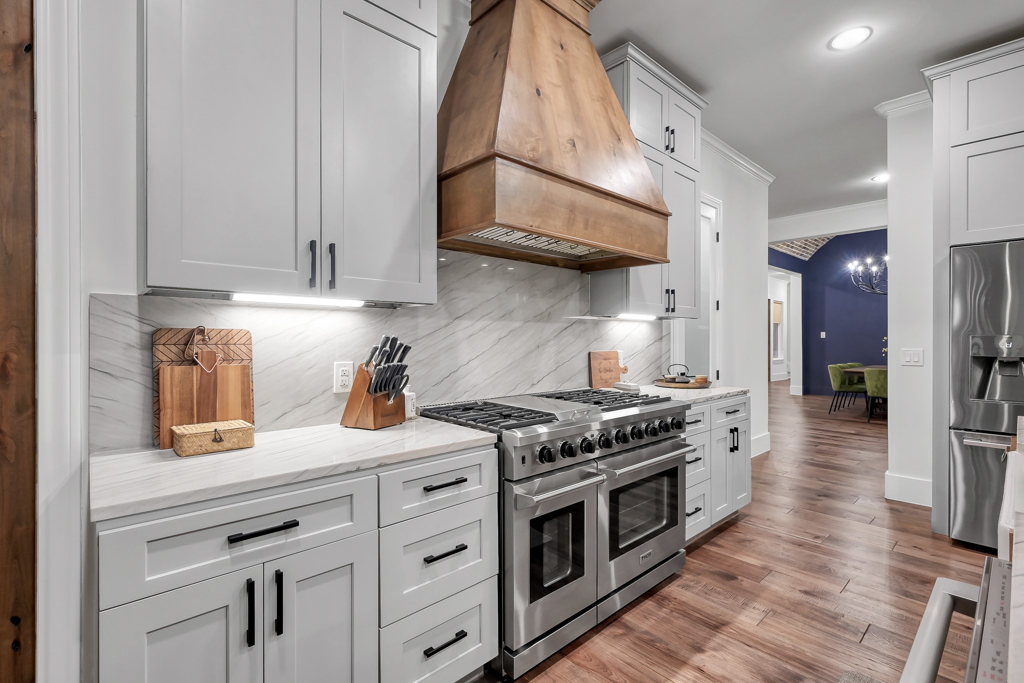15937 Stagecoach Road Stagecoach, TX 77355 - Photo 18 of 50 a kitchen with stainless steel appliances granite countertop a stove a sink and a refrigerator