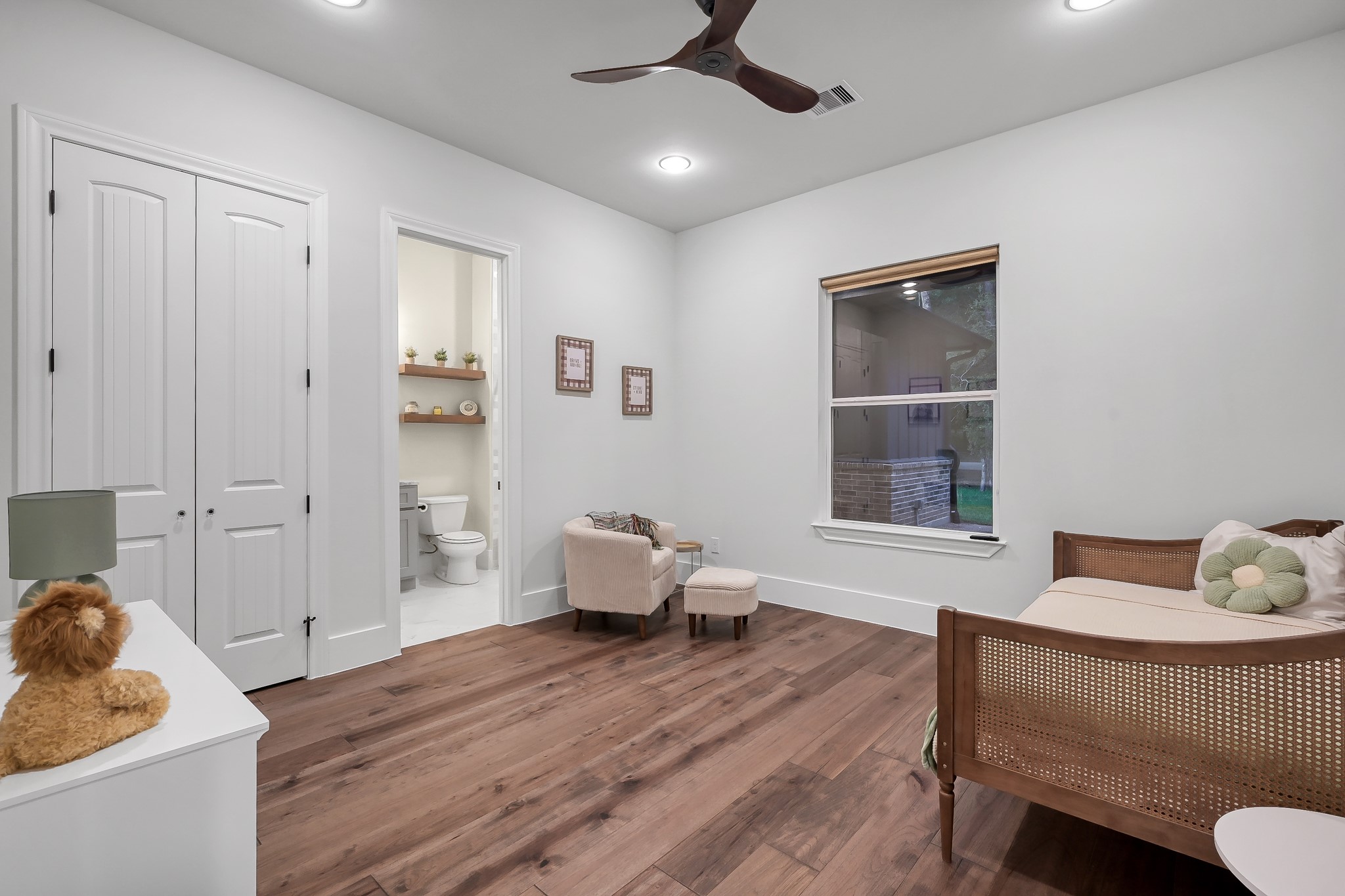 15937 Stagecoach Road Stagecoach, TX 77355 - Photo 25 of 50 a bedroom with a bed and wooden floor