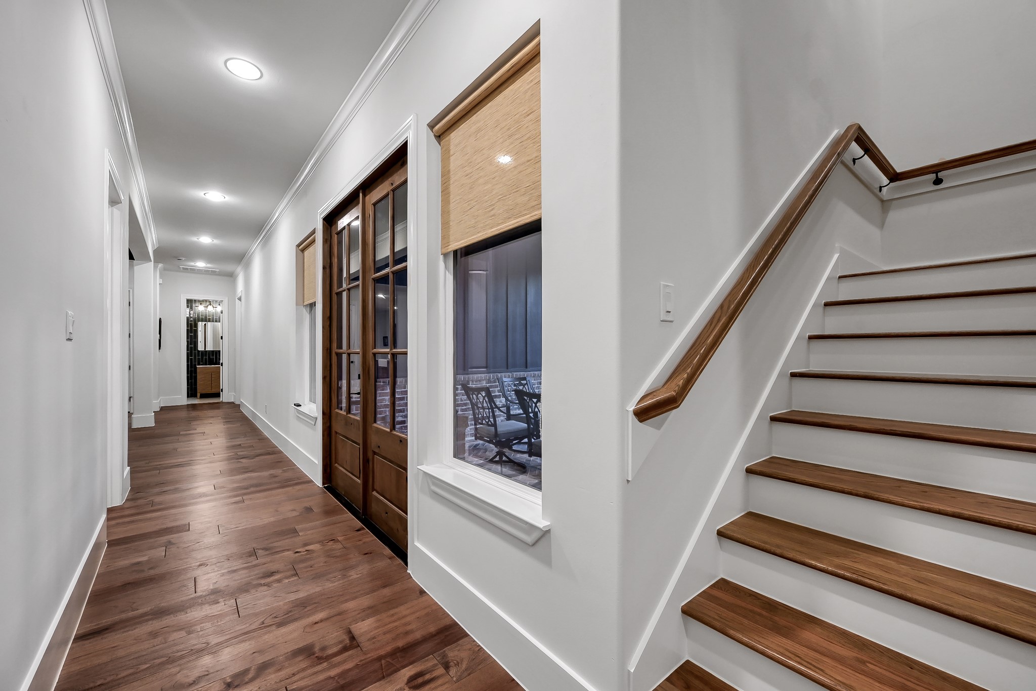 15937 Stagecoach Road Stagecoach, TX 77355 - Photo 28 of 50 a view of a hallway with wooden floor and staircase