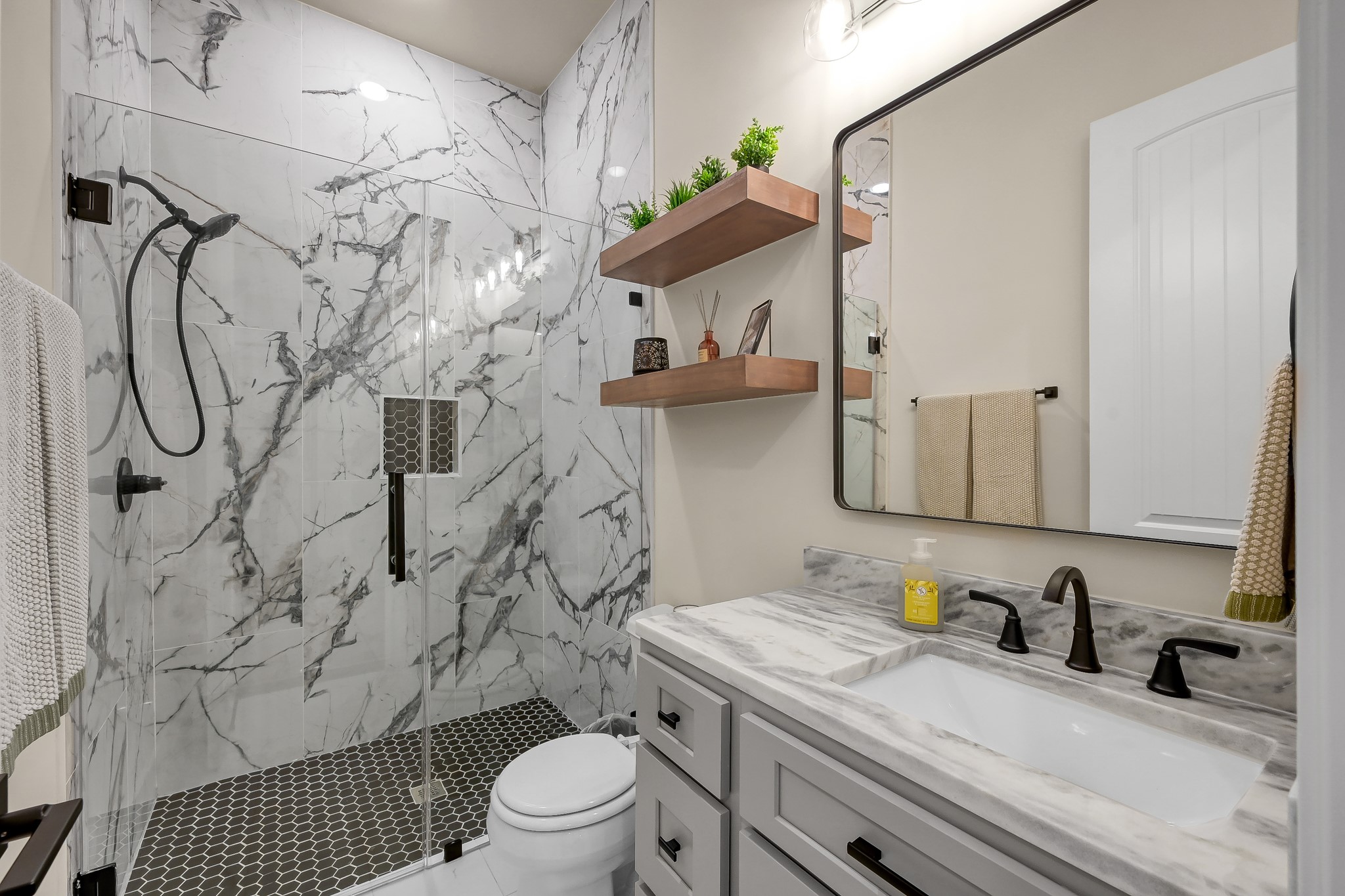 15937 Stagecoach Road Stagecoach, TX 77355 - Photo 33 of 50 a bathroom with a granite countertop sink a toilet and shower