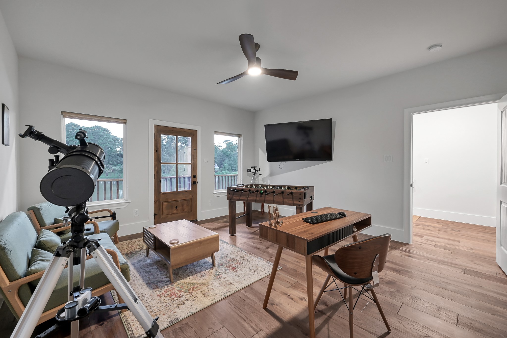 15937 Stagecoach Road Stagecoach, TX 77355 - Photo 35 of 50 a living room with furniture and a flat screen tv