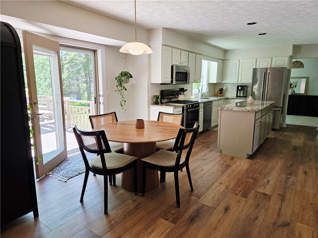 1081 Bright Stream Way Webster, NY 14580 - Photo 50 of 50 The open floor plan here creates space for all.