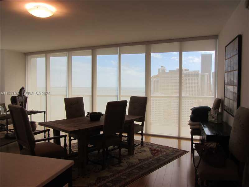 495 Brickell Avenue, Unit 2401 Miami, FL 33131 - Photo 17 of 33 a view of a dining room with furniture window and outside view