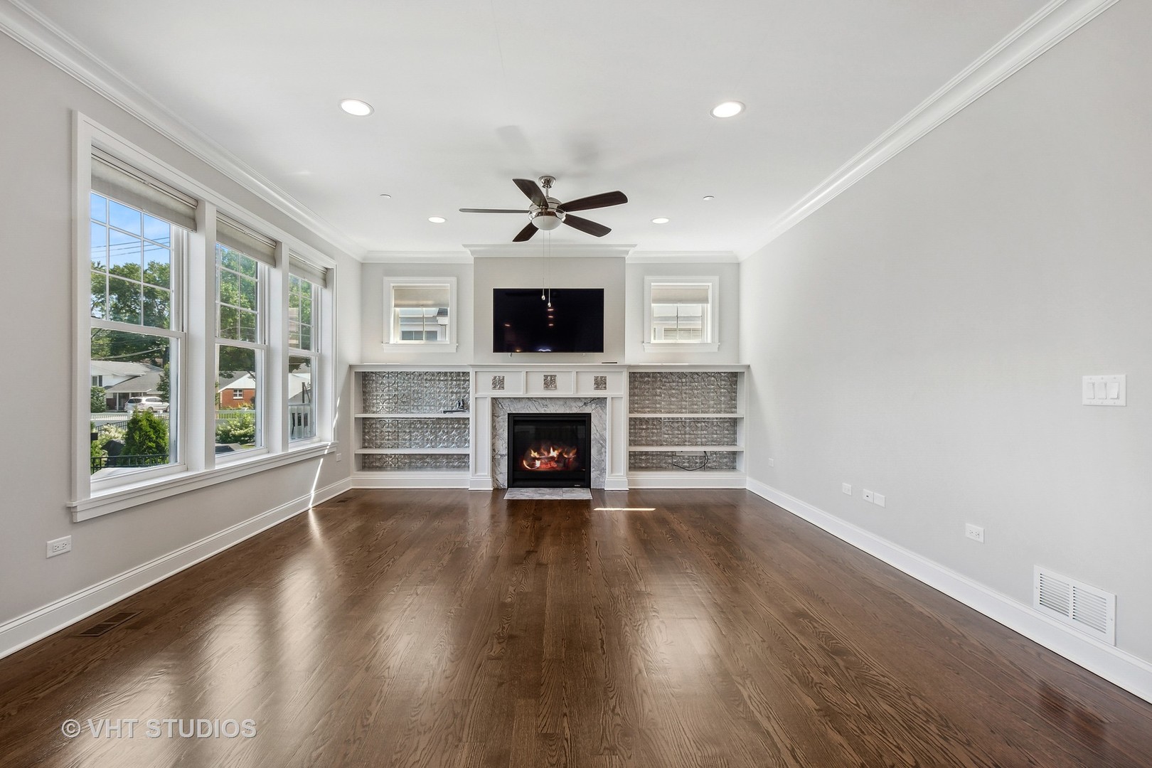 2004 West Sibley Street Park Ridge, IL 60068 - Photo 11 of 40 an empty room with fireplace wooden floor and windows