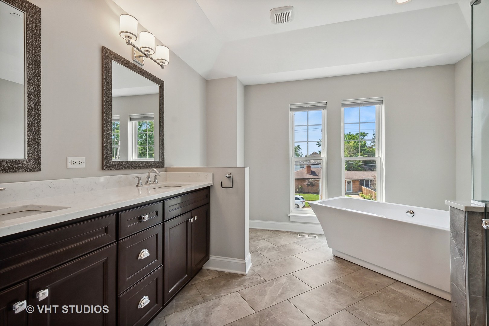 2004 West Sibley Street Park Ridge, IL 60068 - Photo 19 of 40 a spacious bathroom with a granite countertop sink a mirror and a bathtub