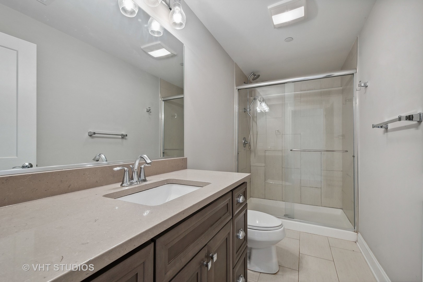 2004 West Sibley Street Park Ridge, IL 60068 - Photo 26 of 40 a bathroom with a sink a toilet a mirror and shower