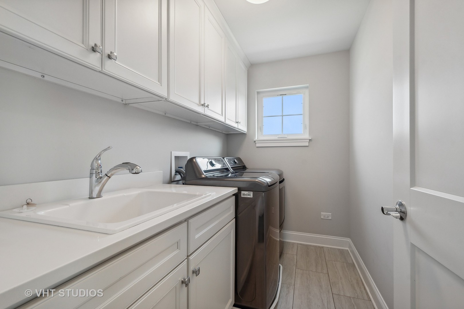 2004 West Sibley Street Park Ridge, IL 60068 - Photo 29 of 40 a utility room with sink dryer and washer