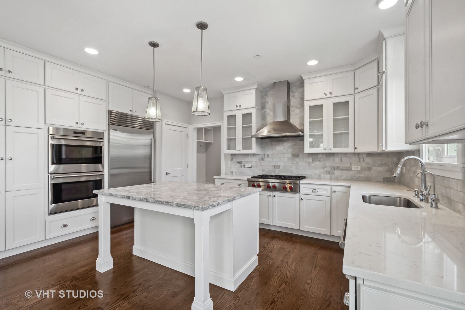 2004 West Sibley Street Park Ridge, IL 60068 - Photo 7 of 40 a kitchen with stainless steel appliances granite countertop a sink a stove a refrigerator cabinets and wooden floor