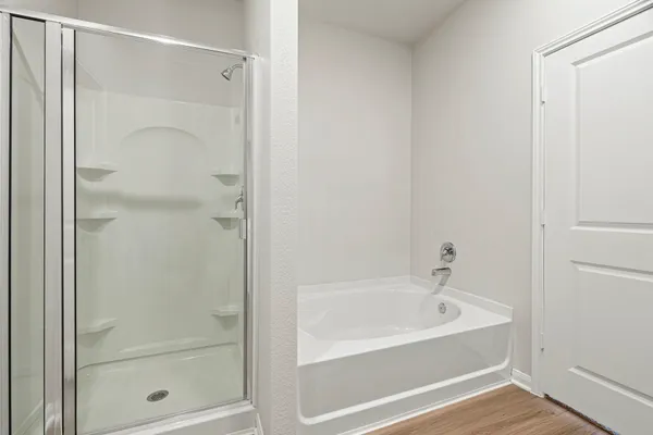 a bathroom with a bathtub and a shower