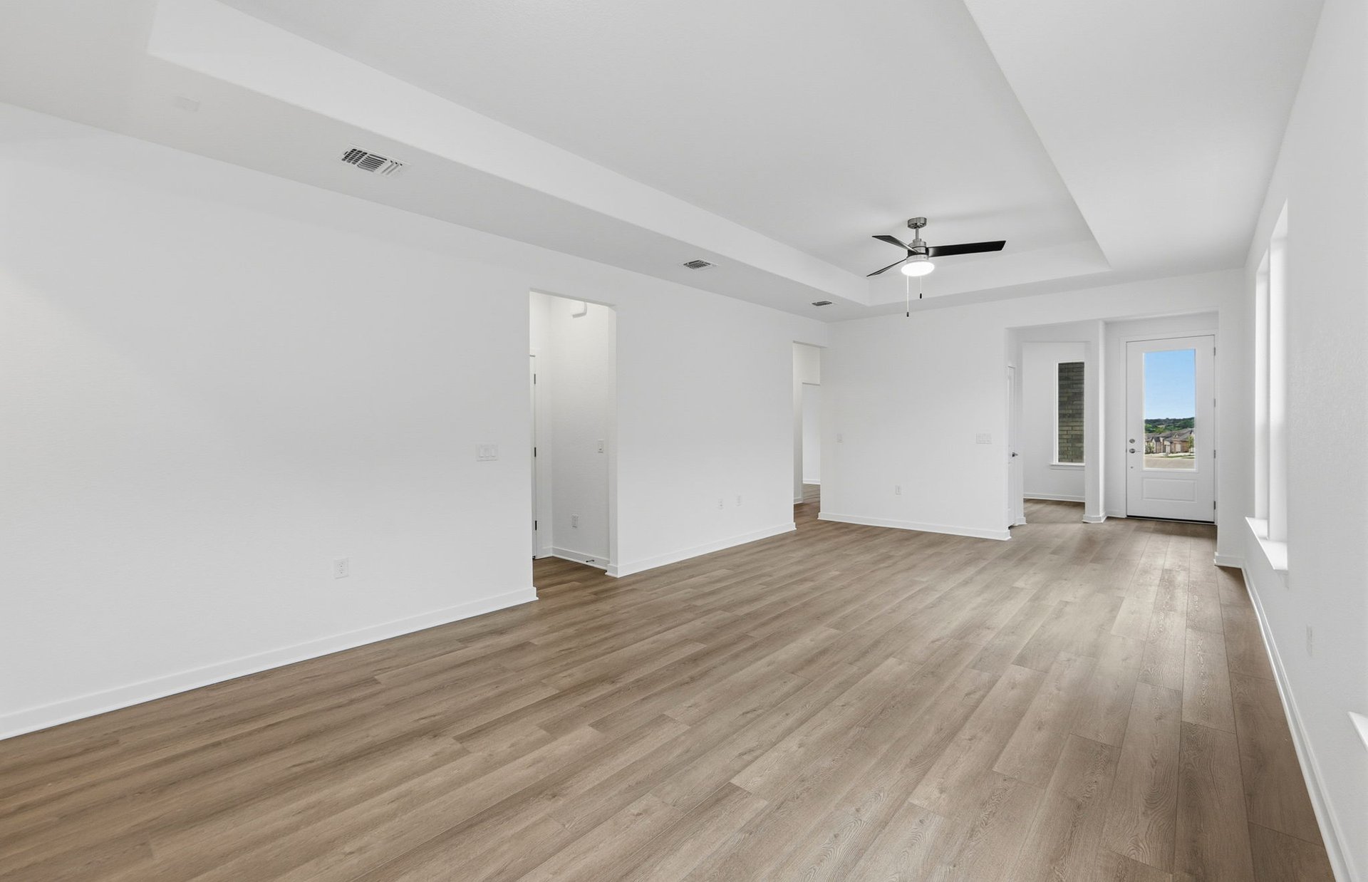 1010 Martingale Street Georgetown, TX 78633 - Photo 7 of 23 a view of empty room with wooden floor and ceiling fan