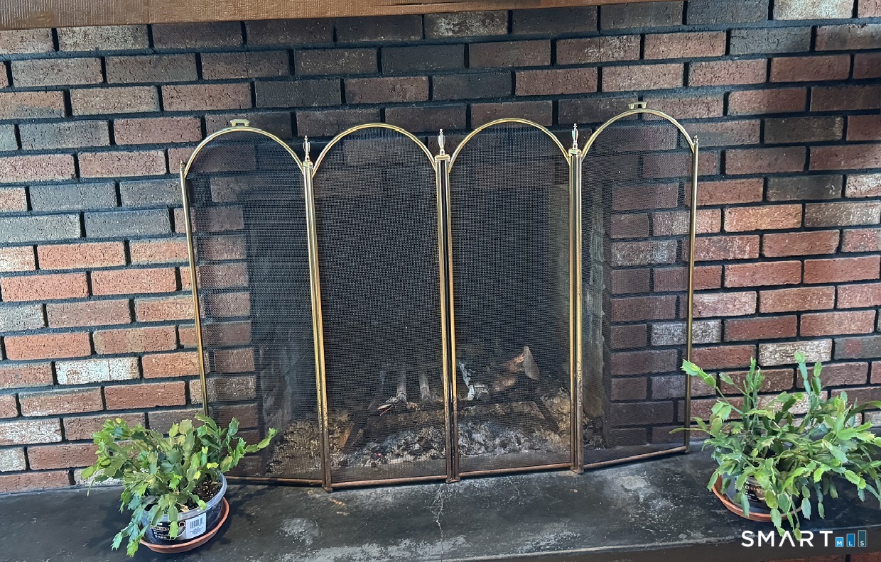 879 Congress Avenue Waterbury, CT 06708 - Photo 17 of 32 living room wood burning fireplace