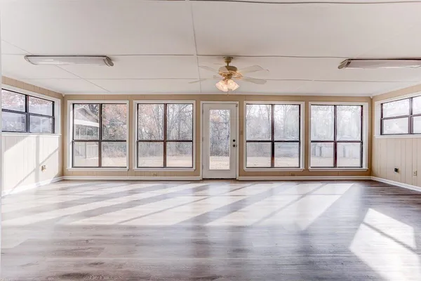 a view of an empty room with a window