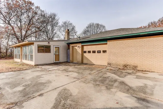 a view of a house with a snow on the road