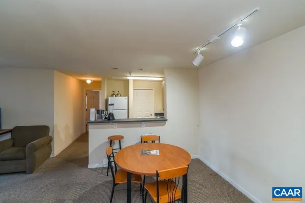 a workspace with furniture and mirror