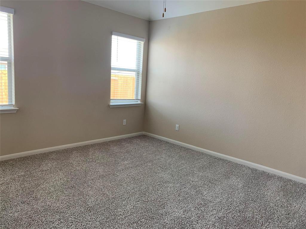 263 Honeysuckle Princeton, TX 75407 - Photo 2 of 10 an empty room with a window