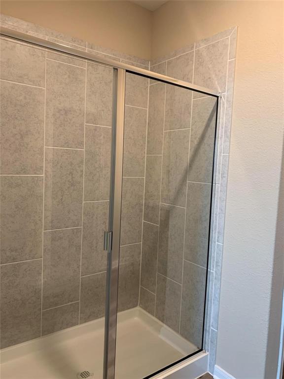 263 Honeysuckle Princeton, TX 75407 - Photo 5 of 10 a bathroom with a shower