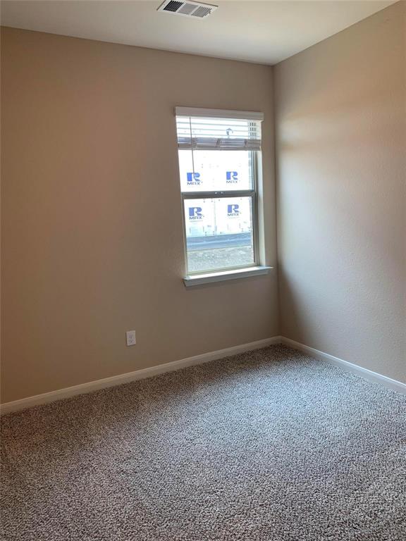 263 Honeysuckle Princeton, TX 75407 - Photo 9 of 10 an empty room with a window