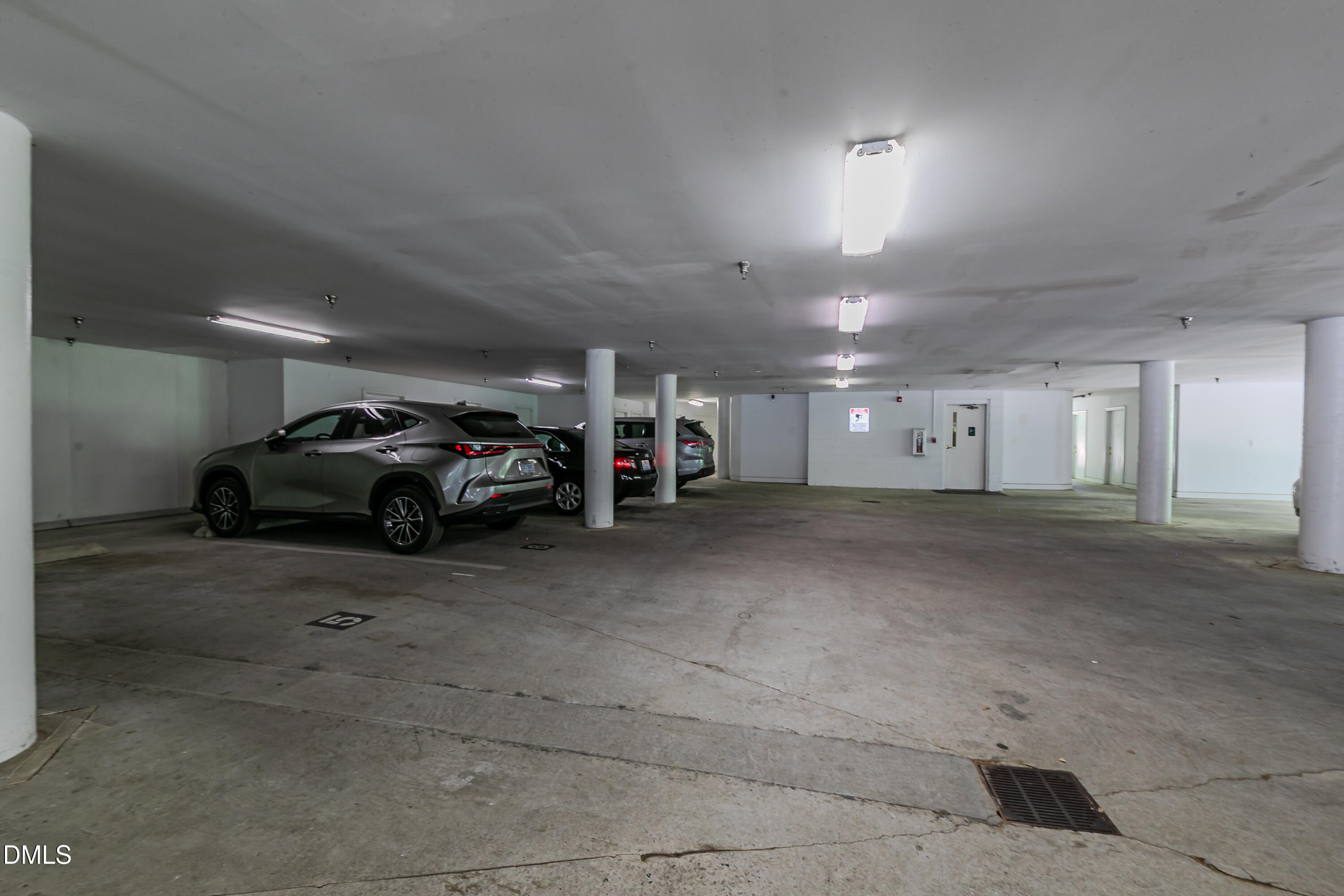 116 Northbrook Drive, Unit 305 Raleigh, NC 27609 - Photo 43 of 43 a view of parking space and a car parked in garage