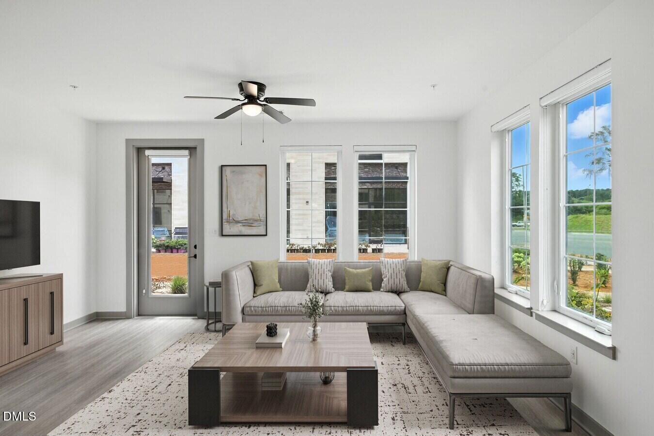 1000 Martin Luther King Junior Boulevard, Unit TH3 Chapel Hill, NC 27514 - Photo 7 of 12 a living room with furniture and a flat screen tv