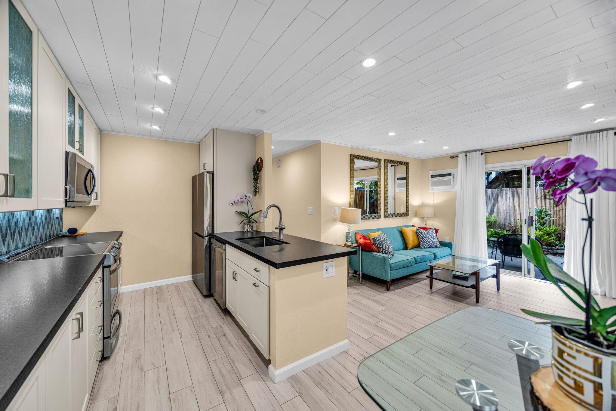 160 Keonekai Road, Unit 8103 Kihei, HI 96753 - Photo 13 of 47 a kitchen with granite countertop lots of counter top space
