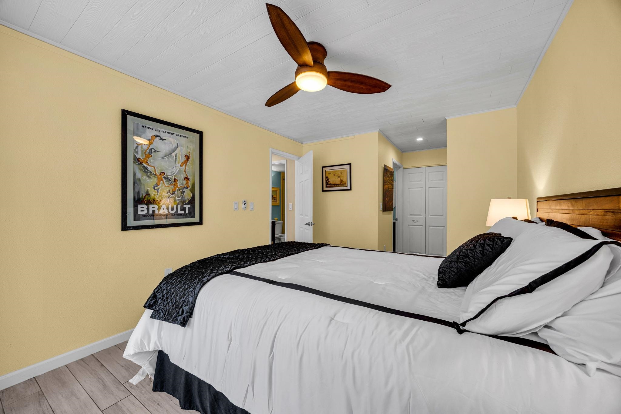 160 Keonekai Road, Unit 8103 Kihei, HI 96753 - Photo 19 of 47 a bedroom with bed and a large mirror