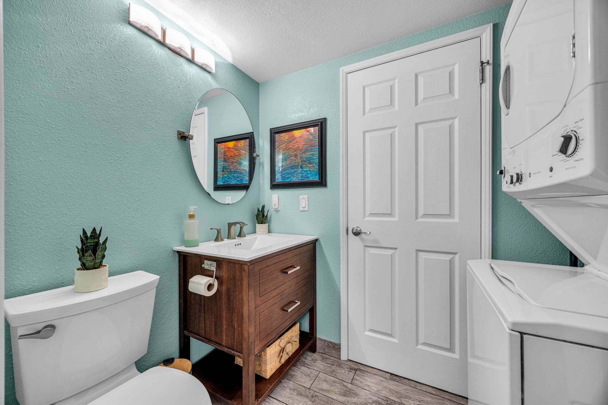 160 Keonekai Road, Unit 8103 Kihei, HI 96753 - Photo 22 of 47 a bathroom with a toilet a sink and a mirror