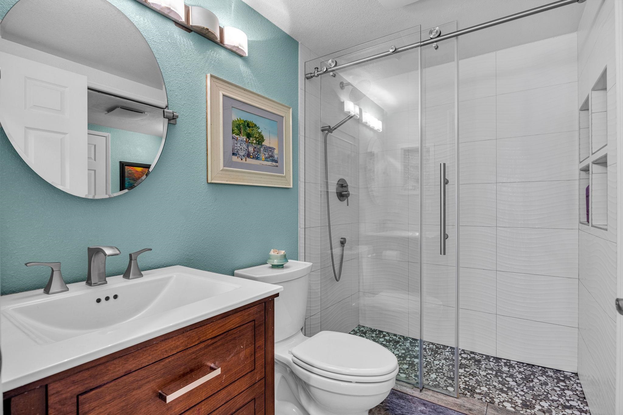 160 Keonekai Road, Unit 8103 Kihei, HI 96753 - Photo 24 of 47 a bathroom with a sink a toilet and shower