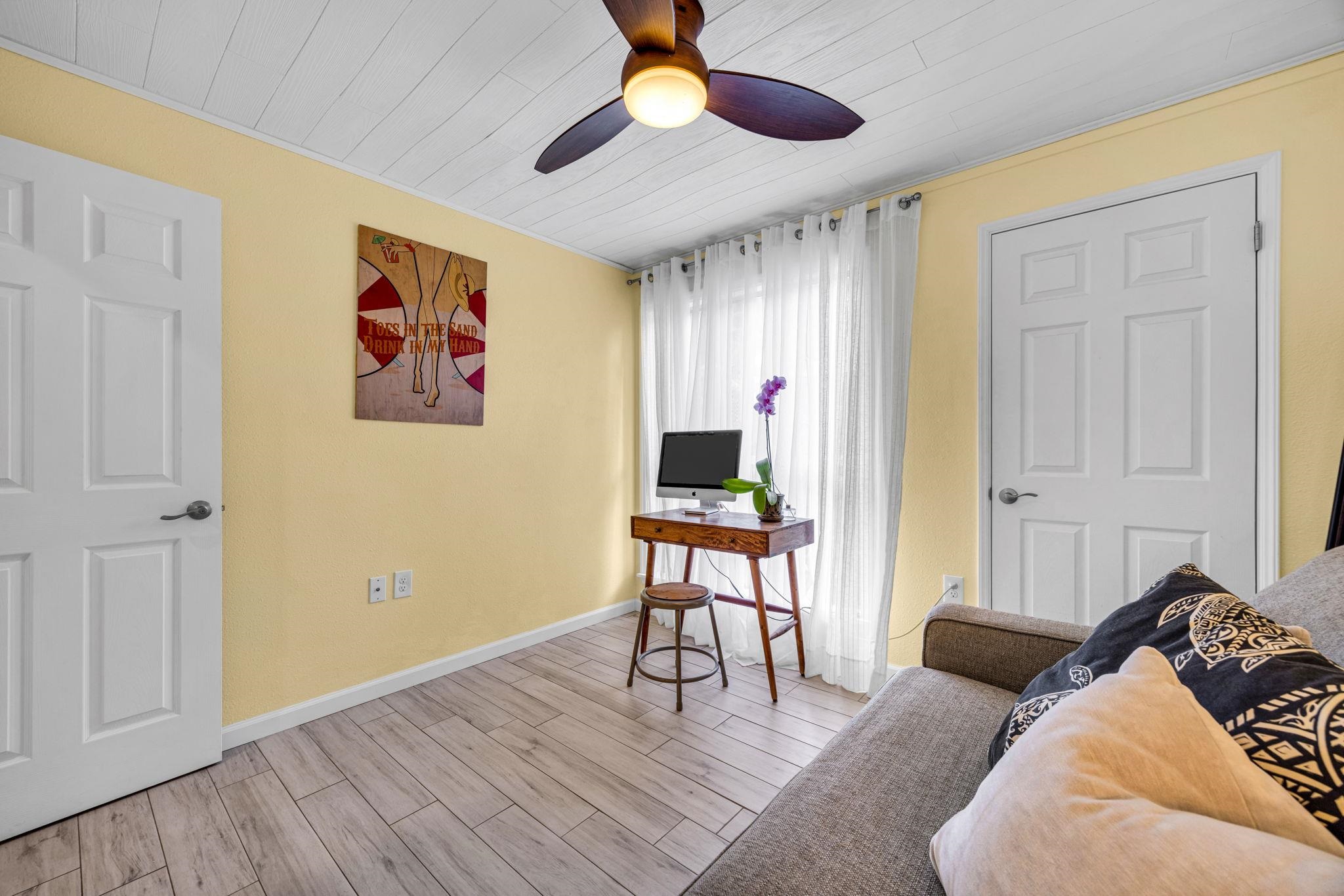 160 Keonekai Road, Unit 8103 Kihei, HI 96753 - Photo 27 of 47 a living room with furniture and a wooden floor