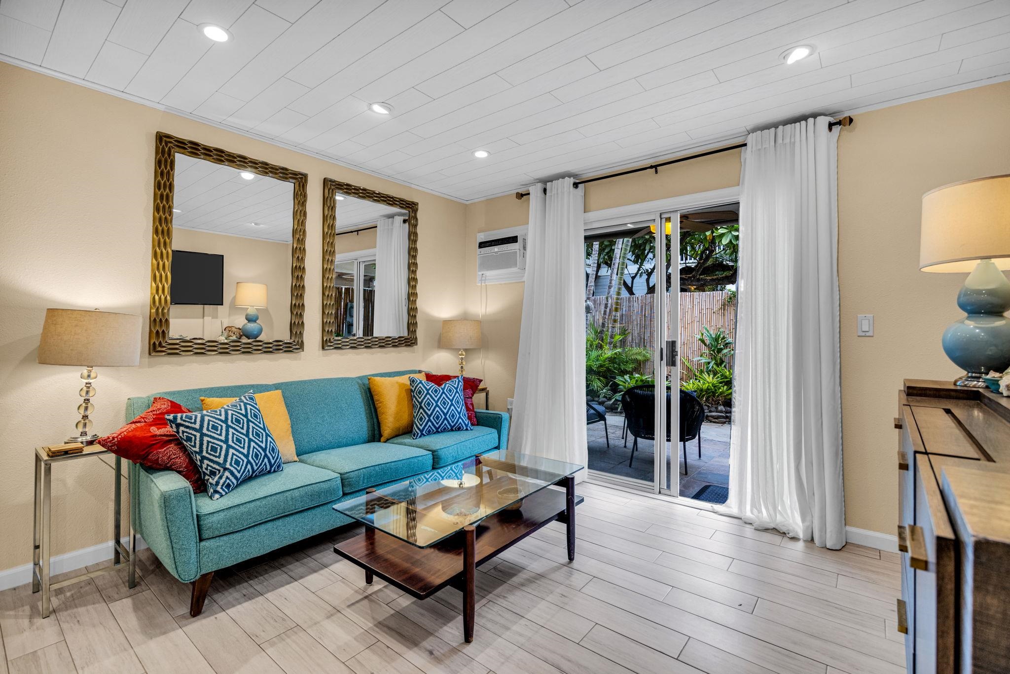 160 Keonekai Road, Unit 8103 Kihei, HI 96753 - Photo 3 of 47 a living room with furniture and a large window