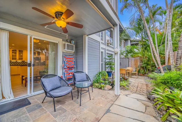 a view of an chairs and table in the patio