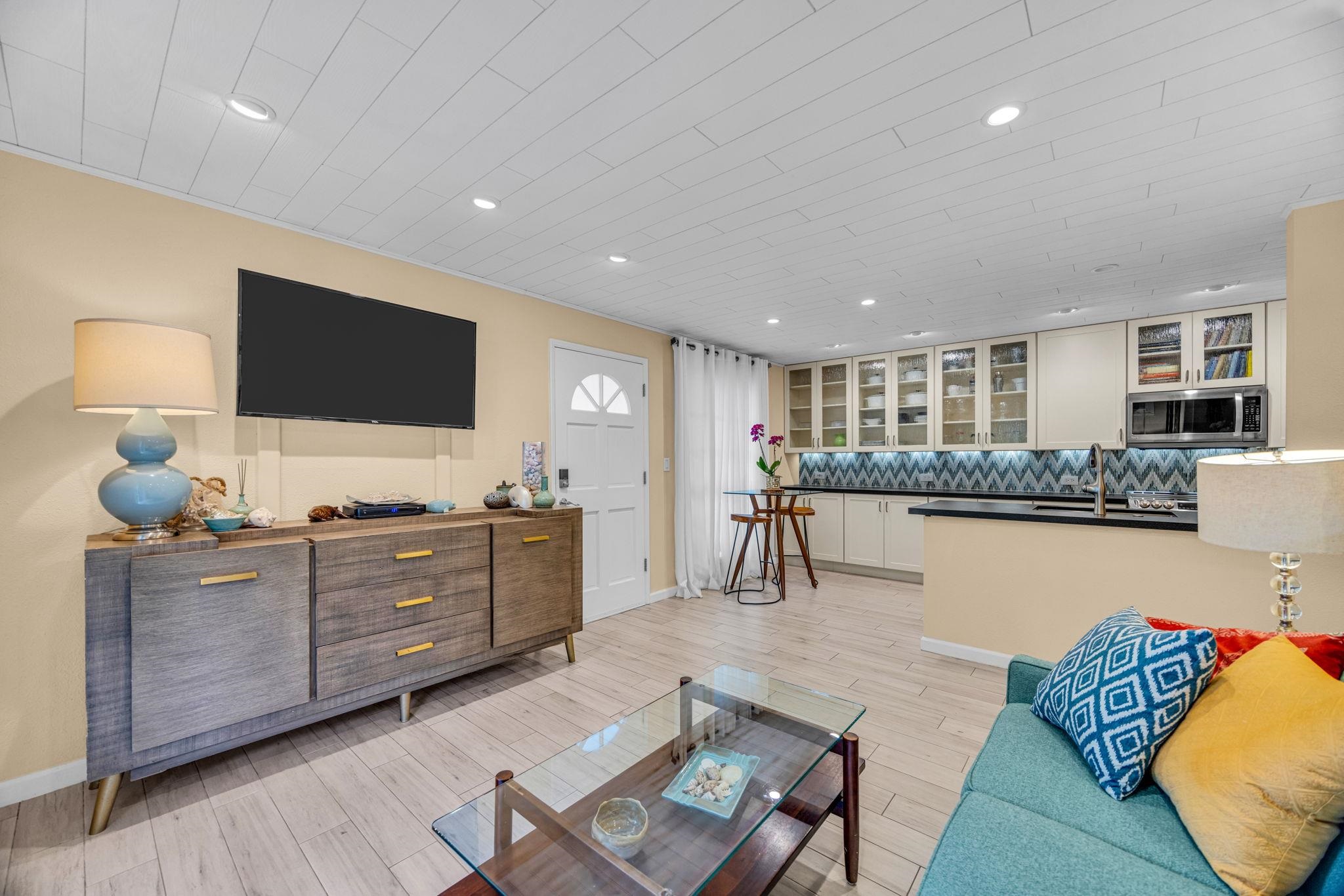 160 Keonekai Road, Unit 8103 Kihei, HI 96753 - Photo 6 of 47 a living room with furniture and a flat screen tv