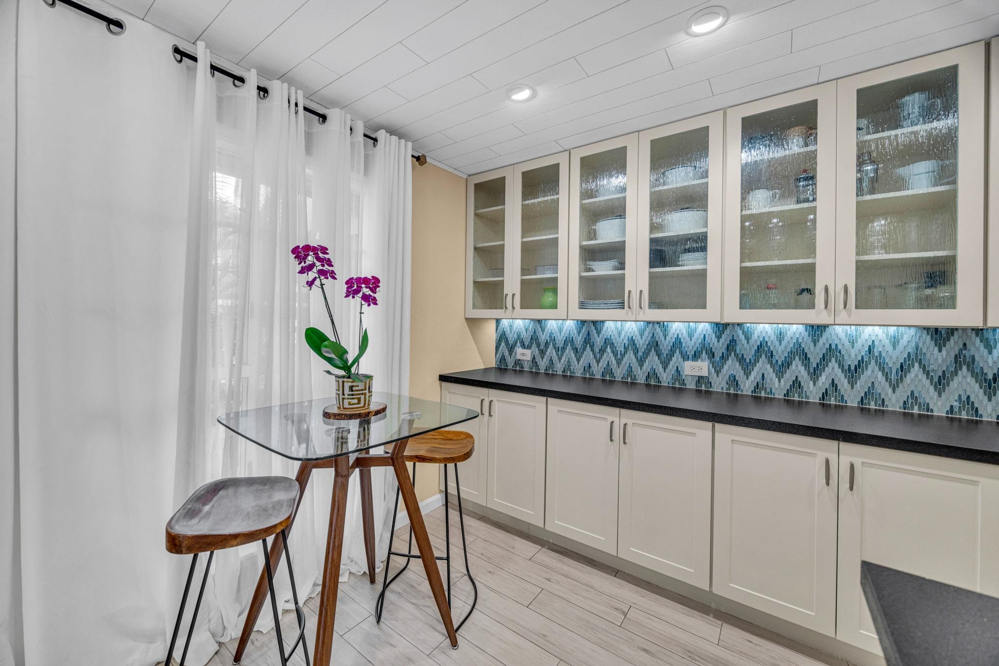 160 Keonekai Road, Unit 8103 Kihei, HI 96753 - Photo 9 of 47 a kitchen with granite countertop sink and cabinets