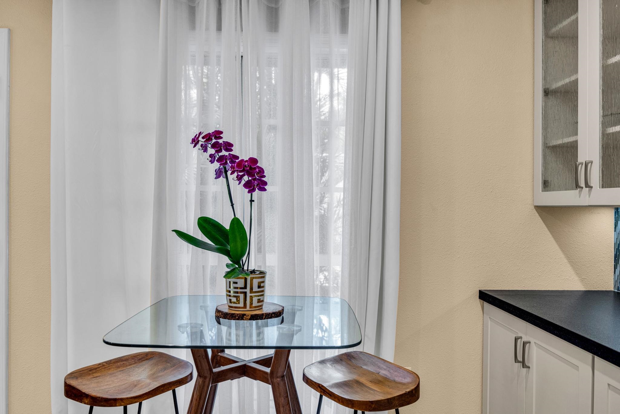 160 Keonekai Road, Unit 8103 Kihei, HI 96753 - Photo 10 of 47 a dining room with furniture and wooden floor