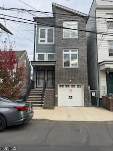 a front view of a house with parking