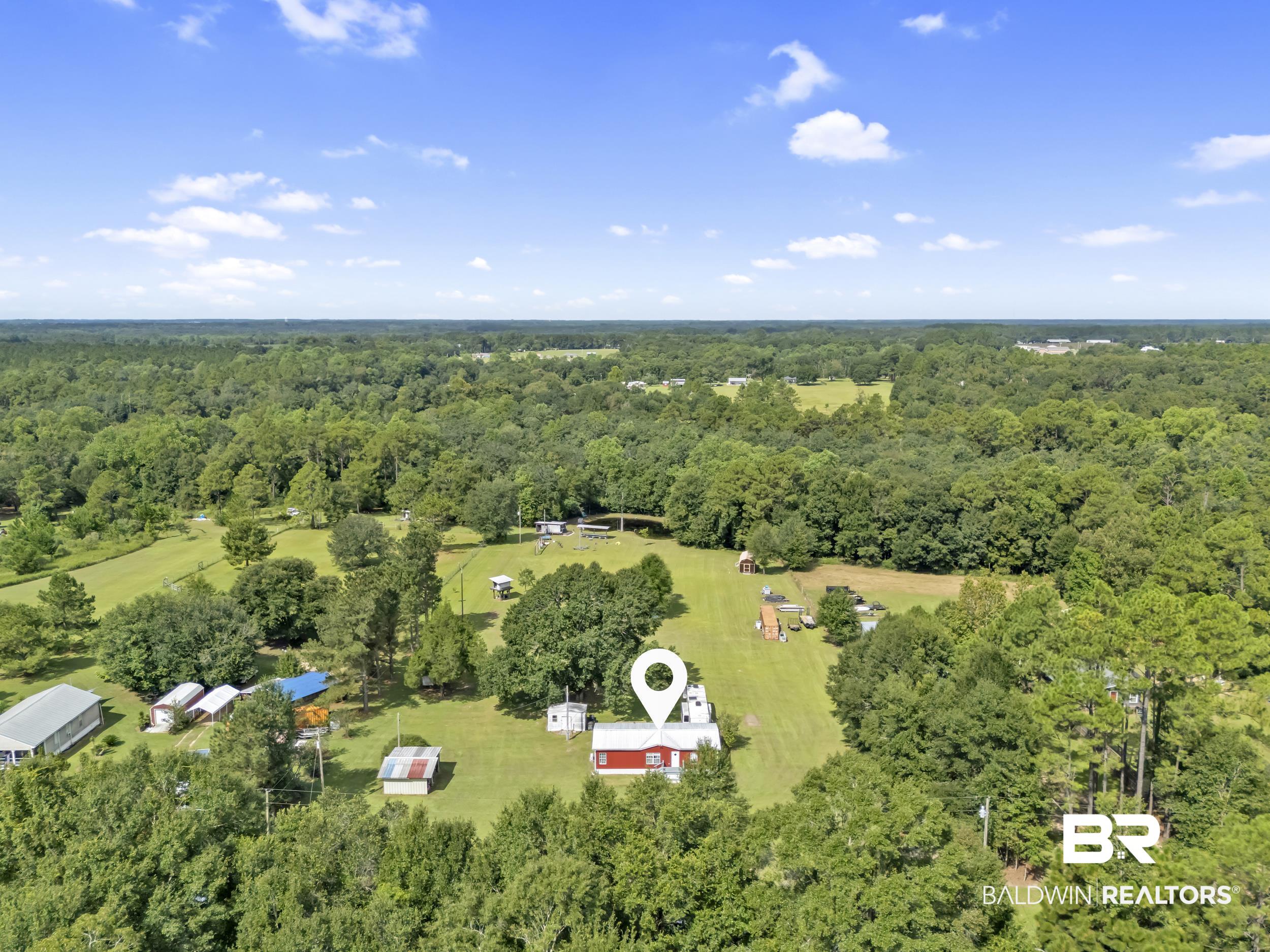 22823 Lanier Road Robertsdale, AL 36567 - Photo 7 of 46 Aerial view of property's location featuring a forest