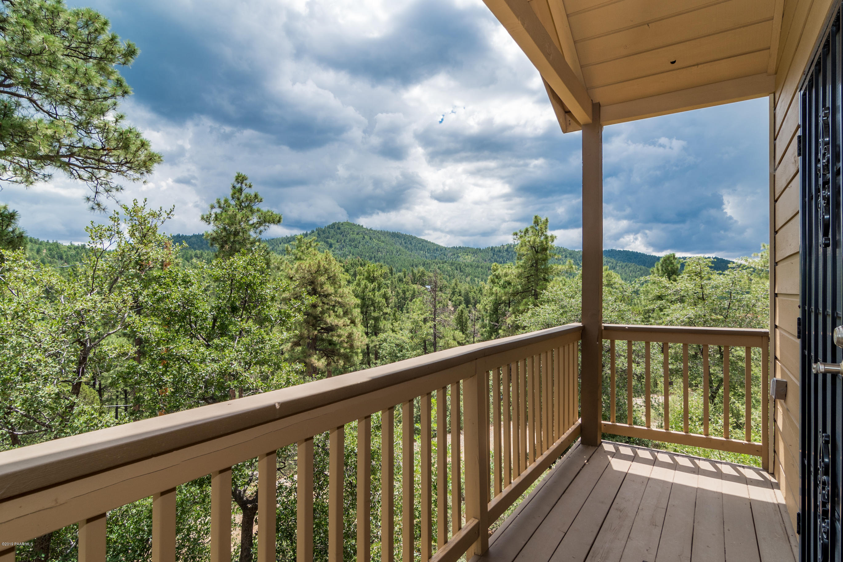 4680 South Stoney Ridge Road Prescott, AZ 86303 - Photo 13 of 39 a view of a wooden deck with a yard