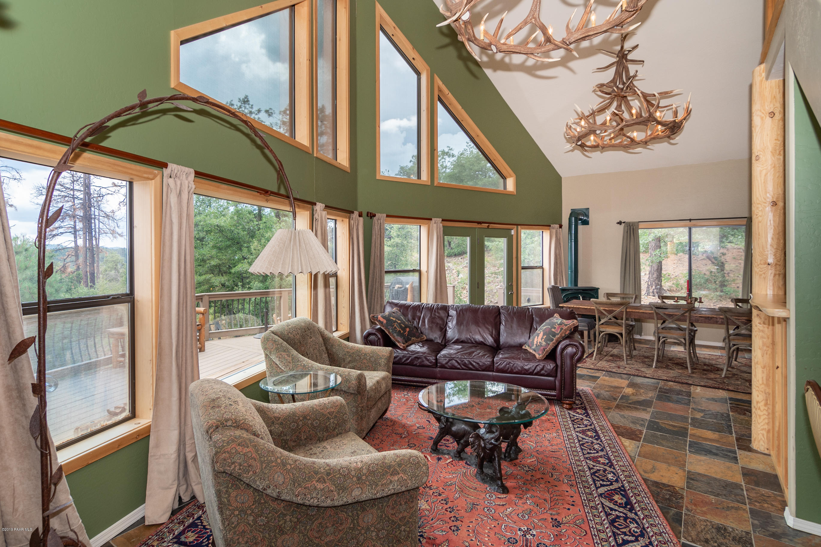 4680 South Stoney Ridge Road Prescott, AZ 86303 - Photo 17 of 39 a living room with furniture and floor to ceiling windows