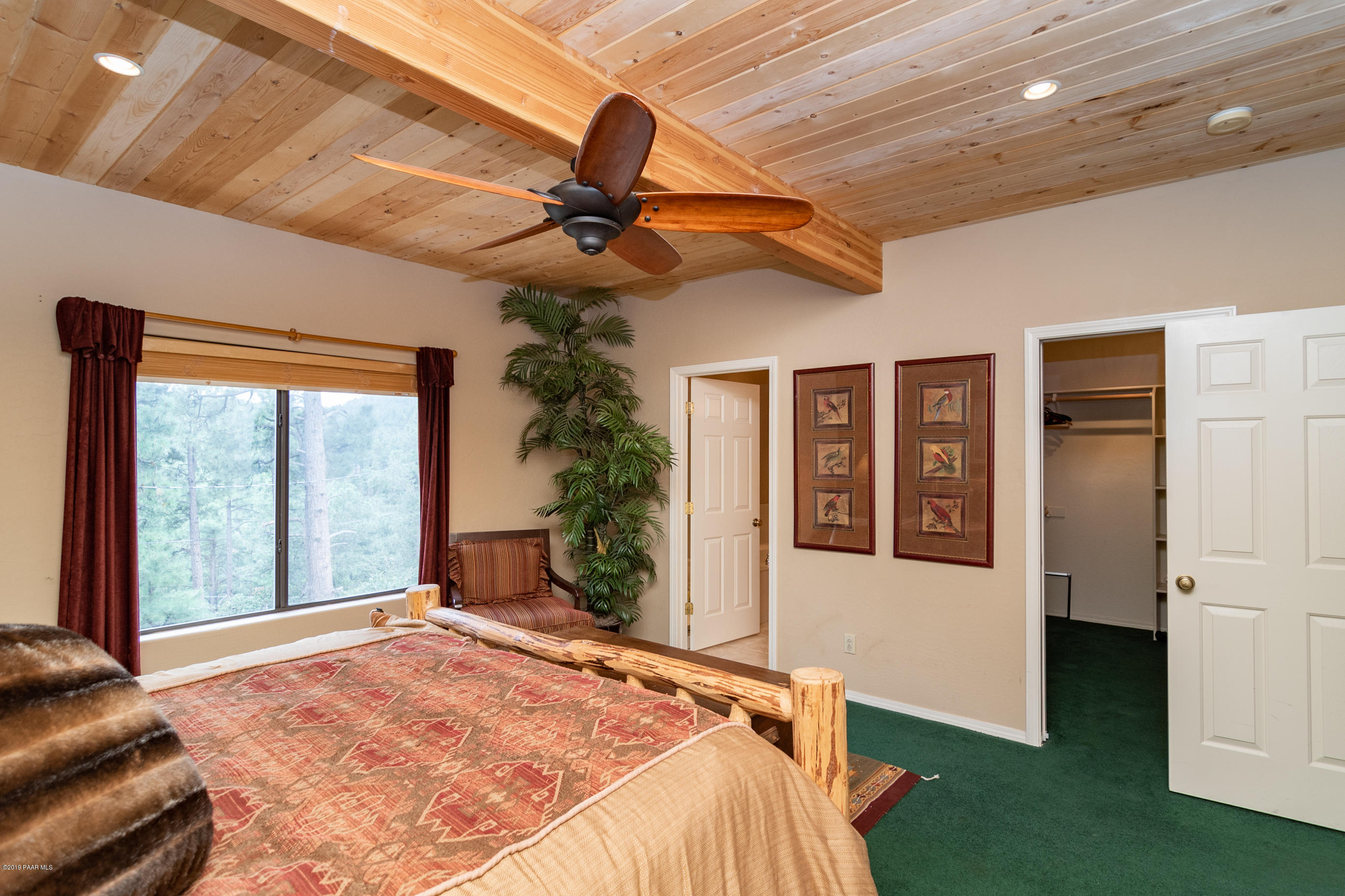 4680 South Stoney Ridge Road Prescott, AZ 86303 - Photo 27 of 39 a bed sitting in a room next to a window